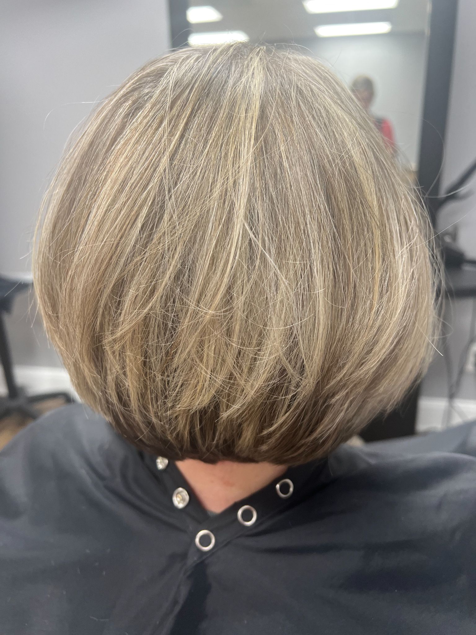 Short blonde bob with highlights at Magnolias Hair Salon
